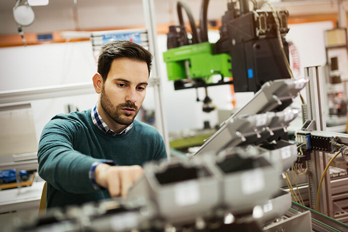 Mechanical engineer working on machines