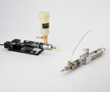 Industrial spray equipment featuring a liquid container, valves, and precision nozzle for effective fluid application.