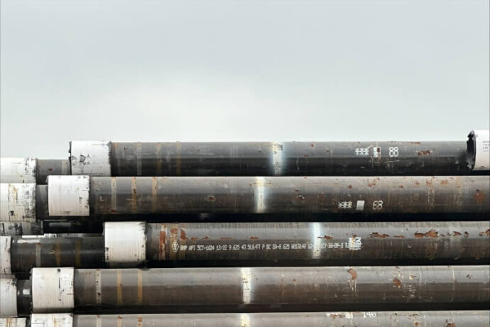 A stack of reject marked pipes